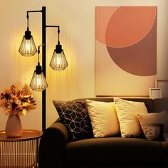 a living room scene with focus on the couch and lamp fixture, which is lit up