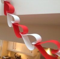 a red and white ribbon hanging from the ceiling