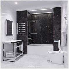 a black and white bathroom with marble walls