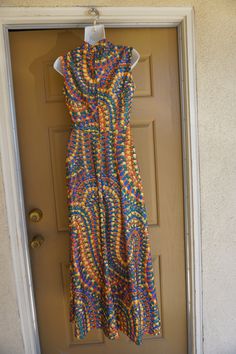 "Vintage 1970s maxi dress. No tags fits like a Large. In good vintage condition. no stains, holes, or tears. Please see measurements. Measurements taken across front lying flat 19\" across front armpit to armpit 14\" across front of empire waist 17\" across natural waist 55\" length" 1970s Fitted Sleeveless Maxi Dress, Fitted Retro Print Maxi Dress, Retro Print Maxi Dress For Summer, 70s Inspired Fitted Maxi Dress, 1970s Fitted Multicolor Maxi Dress, 1970s Style Fitted Multicolor Maxi Dress, 1970s Style Multicolor Maxi Dress, Vintage Multicolor Sleeveless Maxi Dress, Multicolor Sleeveless Vintage Maxi Dress