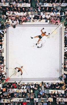 an overhead view of two men wrestling in a ring