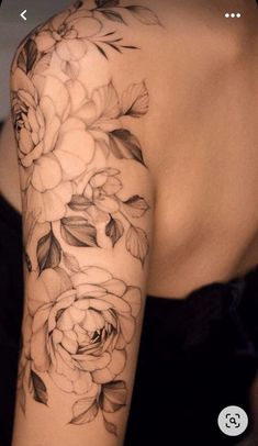 a woman's arm with flowers on it