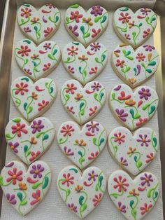 decorated cookies in the shape of hearts and flowers