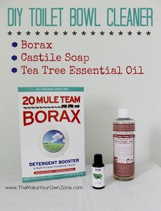 a bottle of tea tree essential oil next to a box of borax soap