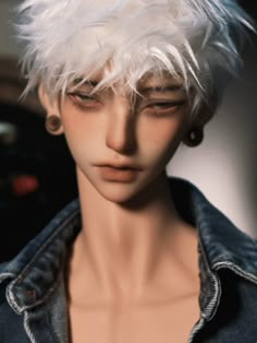 a mannequin with white hair wearing a denim jacket