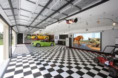 a large garage with black and white checkered flooring