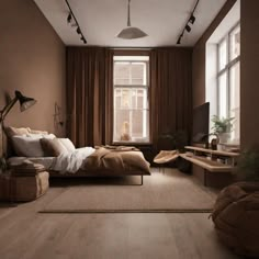 a bedroom with a bed, desks and windows in the corner is lit by two lamps