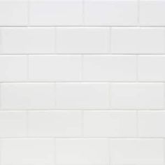 a white tiled wall with no one in it