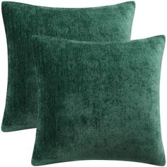 two green velvet pillows on white background