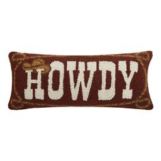 a brown and white pillow with the word hoddy on it