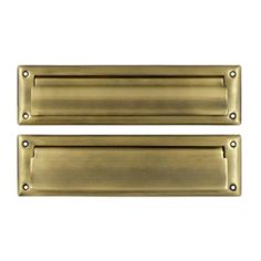 two brass door handles on white background