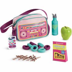 an assortment of toys including a pink bag, ear buds and other items for play