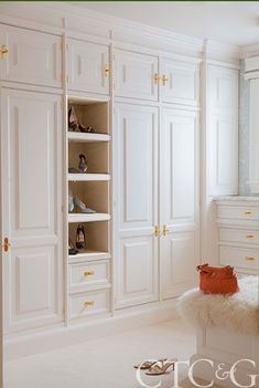 a bedroom with white closets and shoes on the floor