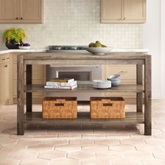 a kitchen island with two baskets under it