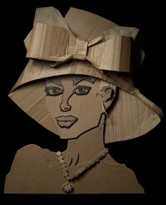 a cardboard cut out of a woman's face wearing a hat