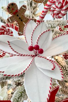 a christmas tree decorated with candy canes and decorations