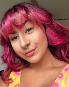 person with bright magenta pink hair color on pre-lightened long hair Lightened Hair, Hair Turban