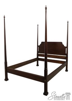 a wooden bed frame with four posts and no headboard or foot board is shown