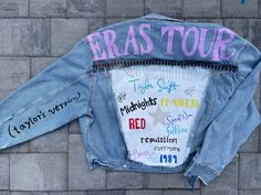 a jean jacket with writing on it that says eras tour