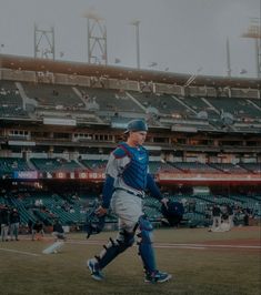 a baseball player is walking on the field