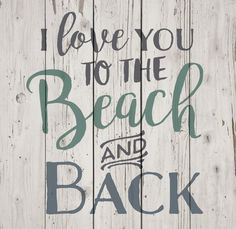 i love you to the beach and back sign on wooden planks with hand drawn lettering