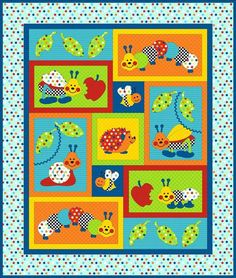 a colorful quilt with animals and hearts on it