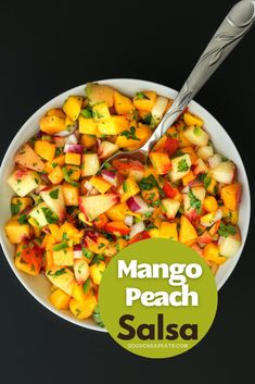 mango peach salsa in a white bowl with a spoon on the side and text overlay that reads mango peach salsa