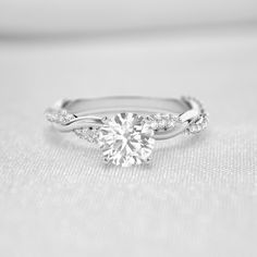 Shown in 1.0 Carat * The Amelia Diamond Twist Engagement Ring | Lisa Robin#_shape-round Ring With Twisted Band, Twist Band Rings, Diamond Ring With Twisted Band, Twisted Ring Engagement, Simple Elegant Engagement Rings Vintage, Small Diamond Ring Engagement, Engagement Rings Low Profile, Twist Band Engagement Rings, Engagement Rings Twisted Band