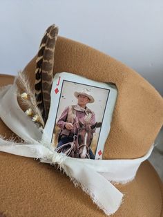 John Wayne "The Duke" Cowboy Playing card to add to your hat band for a custom hat.  Want to customize your favorite hat? Add a Hat band, Pin and Cowboy playing card for a custom look.  Update your favorite western hat.  The possibilities for a custom hat are endless!  Plenty of card options-- want to see more  or a special face card from the deck -- message me for more options!!   Looking for a different card let me know - I have a ton of them!!  These cards come with burnt corners and can be c Playing Card Hat Band, Fedora Hat Bands For Kentucky Derby Gift, Neon Cowgirl, Western Hat, Fancy Hats