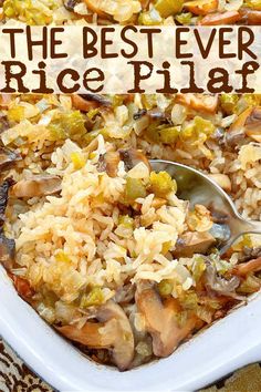 the best ever rice pilaf in a white casserole dish with a spoon