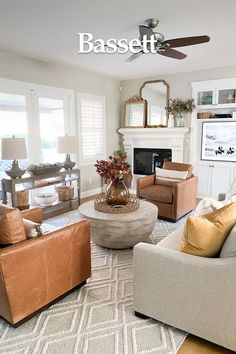 a living room filled with furniture and a fire place in the middle of the room