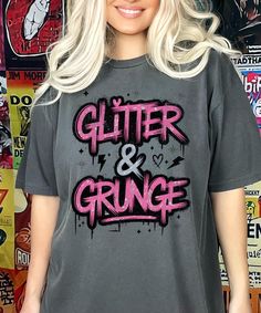 Channel your inner indie sleaze brat with our "Glitter & Grunge" t-shirt! This piece blends messy glam with edgy rebellion, perfect for those who thrive on chaos and bold statements. With its glittery lettering and gritty aesthetic, it's your ultimate go-to for that bratcore vibe. Rock this tee at underground parties, late-night gigs, or just while embracing your carefree attitude. It's the perfect balance of unapologetic glam and throwback grunge, designed for the bold and the bratty. Comfort Colors introduces the "Comfort Colors 1717" garment-dyed t-shirt; a fully customizable tee made 100% with ring-spun cotton. The soft-washed, garment-dyed fabric brings extra coziness to your wardrobe while the relaxed fit makes it an excellent daily choice. The double-needle stitching throughout the Edgy Text Print T-shirt For Alternative Fashion, Trendy Alternative Fashion T-shirt With Text Print, Rock Style Distressed T-shirt For Streetwear, Acid Wash Grunge Graphic T-shirt, Gritty Aesthetic, Glitter Grunge, Distressed Rock T-shirt For Streetwear, Indie Sleeze, Tshirt Grunge