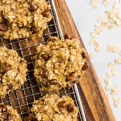 oatmeal chocolate chip cookies cooling on a wire rack next to some nuts