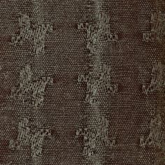 an upholstered fabric with small holes in the middle