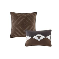 two brown and white pillows with diamond design on the front, one in black and one in