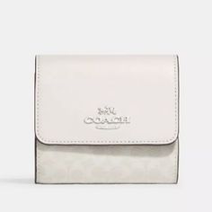 Brand New Optic White/Silver Signature Coated Canvas And Leather Small Wallet From Coach. Gift Box Included White Bifold Wallet For Gift, White Bifold Wallet As Gift, Luxury White Coach Wallet, Elegant White Compact Wallet, Elegant White Wallet For Formal Occasions, Coach Silver Wallet For Everyday Use, Coach Silver Wallets For Everyday Use, Compact White Wallets For Gift, Compact White Wallet As Gift