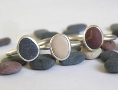 Handmade Tiny coloured Pebble ring made to your size. Choose your ring size then select your 'one of a kind' tiny Colonsay pebble from the picture (number on the right). The ring is set with a pebble that was collected on the Isle of Colonsay, Scotland and has been naturally smoothed and shaped by the sea. This unique ring is carefully finished by hand and the silver will have a satin finish. Made using recycled silver. The ring band will be made using 1.8mm round wire. Once the order is receive Colonsay Scotland, Pebbles Jewelry, Pebble Jewelry, Pebble Ring, Future Ideas, The Isle, Recycled Silver, Unique Ring, Jewellery Design