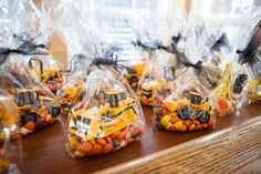 small bags filled with candy sitting on top of a table