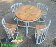 the table and chairs are all made out of metal with wood tops on each side