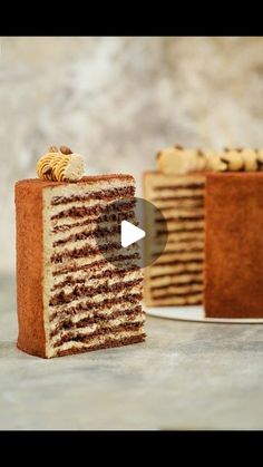 a piece of cake sitting on top of a white plate next to another slice of cake