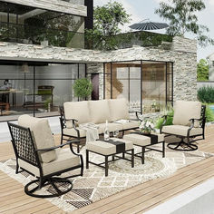 the patio furniture is set up outside by the pool