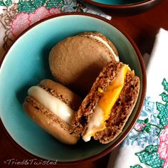 two plates with pastries in them on a table