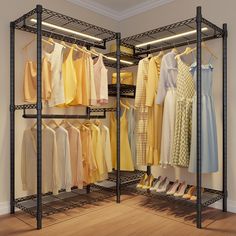 an open closet with clothes and shoes hanging on the racks, in front of a white wall