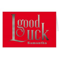 a red greeting card with the words good luck in silver lettering