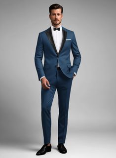 Bring some classic dignity, sophisticated style and warm touch to your work week wardrobe with our Napolean Casa Blue Wool Tuxedo Suit. Crafted from wool blend, this blue tuxedo suit will help you add a splash of color and lighten up your suit wardrobe.  Featuring satin lapel, matching satin covered buttons and gentle texture at its surface, our tuxedo is a subtle fashion-forward take on a traditional tailoring.  Look Includes   Napolean Casa Blue Wool Fabric  Two Button Tuxedo Jacket Style  Notch Lapel  Black Tuxedo Buttons  Single Vent  Three Cuff Buttons  Two Welted Back Pockets on Trousers    Click 'Customize Now' to modify the look if needed.   Jacket is fully lined while the Pants do not have satin lining.   Lining: Viscose; Dry Clean. Suit Wardrobe, Groom Blue Suit, Subtle Fashion, Blue Tuxedo, Blue Tuxedos, Palm Springs Wedding, Tuxedo Suit, Black Tuxedo, Tuxedo Jacket