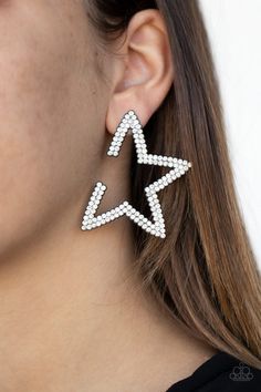 Encrusted in two rows of glassy white rhinestones, a gunmetal star frame dots the ear for a stellar shimmer. To flatter the natural contour of the face, one side angle of the star frame is intentionally left open. Earring attaches to a standard post fitting. Show Taylor Swift, Midnights Outfit, Popstar Outfit, Hannah Montana Costume, Kiss Me At Midnight, Side Angle, Competition Suits, Earrings Trendy, Crystal Stars