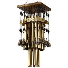 a large metal wind chime with bells hanging from it's sides and numbers on each side