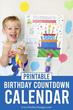 a boy holding a toy in front of a birthday calendar