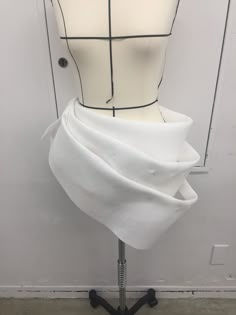 a mannequin with a white dress on it