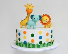 a cake decorated with animals and giraffes